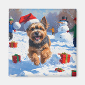 チベットテリア走ーのクリスマス帽子と雪の マグネット (正面)