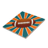 チームはレトロのオレンジおよびティール(緑がかった色)のフットボールを着色します タイル (側面)