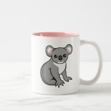 ツートーンピンクのマグを引いているかわいく幸せな灰色のコアラ