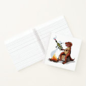 ティラノサウルスレックス料理のキャンプファイヤーの上の食べ物。 ノートブック (内部)