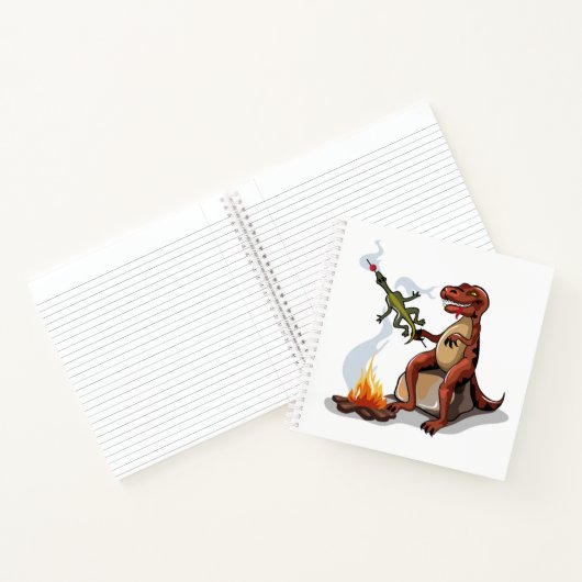 ティラノサウルスレックス料理のキャンプファイヤーの上の食べ物。 ノートブック (内部)