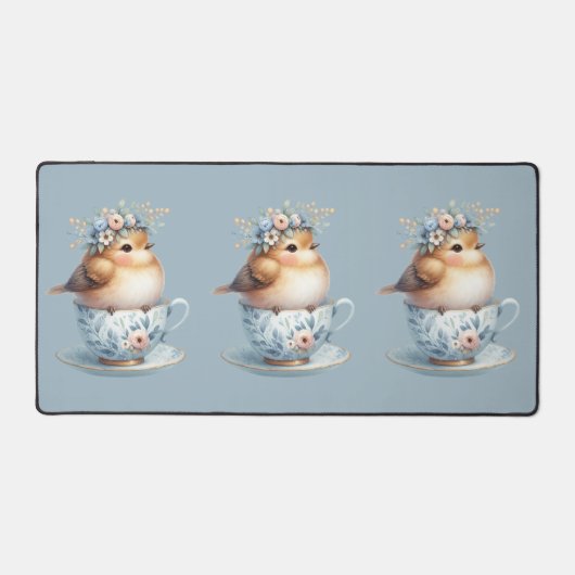 ティーカップにフローラの冠を飾ったかわいい青い鳥 デスクマット (正面)