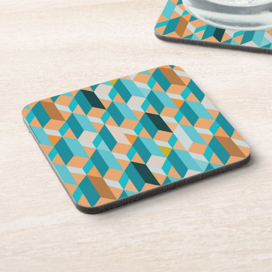 ティール(緑がかった色)およびオレンジ形パターン コースター (左側)