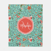 ティール（緑がかった色）とオレンジと赤モノグラムの花のパターン フリースブランケット (正面)