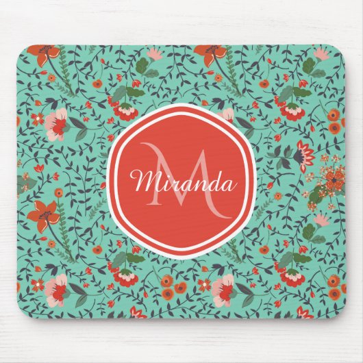 ティール(緑がかった色)とオレンジと赤モノグラムの花のパターン マウスパッド (正面)