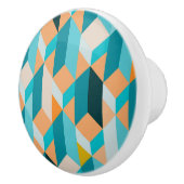 ティール(緑がかった色)とオレンジの形状パターン セラミックノブ (右)