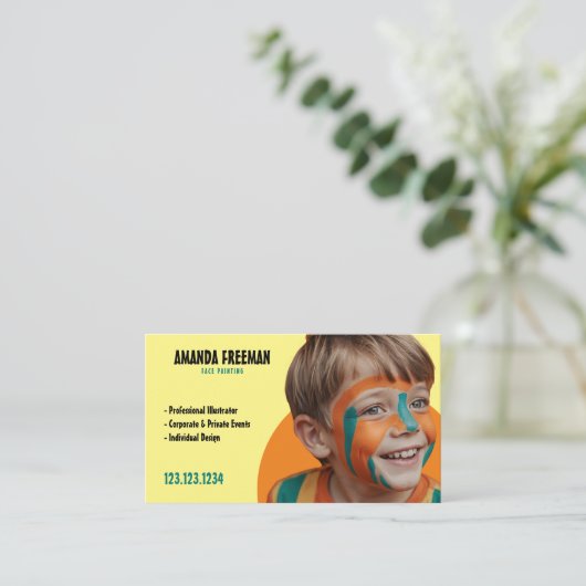ティール(緑がかった色)とユニークイエローアーティスト顔画家 名刺 (スタンド正面)