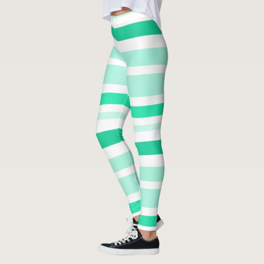 ティール(緑がかった色)と白のストライプのレギンス レギンス (左)