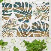 ティール(緑がかった色)と金ゴールドのパターン(の模様が)ある熱帯葉 キッチンタオル (折り畳み)