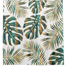 ティール（緑がかった色）と金ゴールドのパターン（の模様が）ある熱帯葉