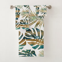 ティール（緑がかった色）と金ゴールドのパターン（の模様が）ある熱帯葉