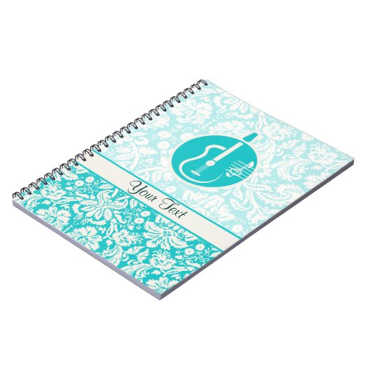 ティール(緑がかった色)のアコースティックギター ノートブック (左側)