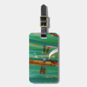 ティール（緑がかった色）の目のトンボにカタチが入る ラゲッジタグ (正面縦)