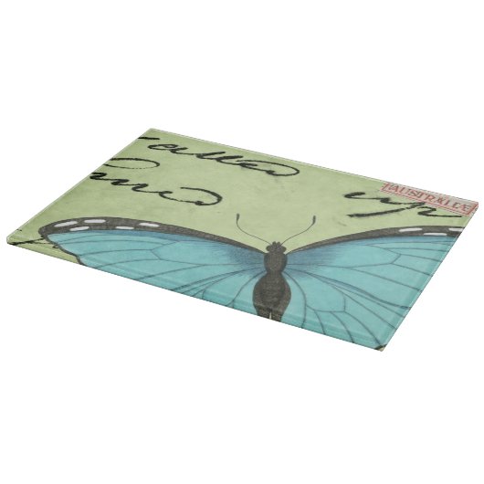ティール（緑がかった色）の郵便はがきの青飛んだ蝶 カッティングボード (角)