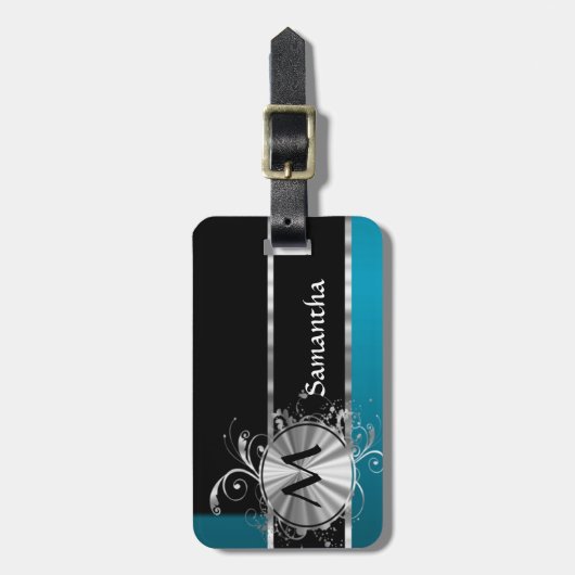 ティール（緑がかった色）の黒く、銀製のモノグラム ラゲッジタグ (正面縦)