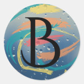 ティール（緑がかった色）、オレンジ、黄色、サンゴのブラシストロークモノグラム ラウンドシール (正面)