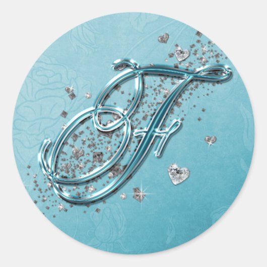 ティール（緑がかった色）ブルーシルバーグリッタースクリプト文字モノグラムF ラウンドシール (正面)