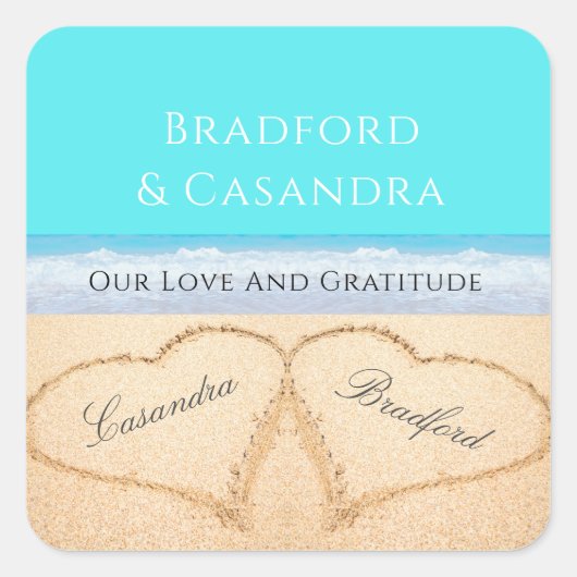ティール（緑がかった色）ブルービーチ結婚式2ハートズインザサンド スクエアシール (正面)