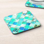 ティール（緑がかった色）、金ゴールド、ブルーグリーンマーメイドパターン コースター (左側)