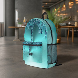 ティール（緑がかった色）金属グリッタードリップモノグラムの プリントバックパック