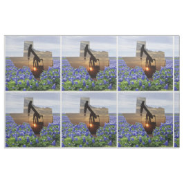 テキサス州の油ポンプのジャックの日没およびBluebonnets ファブリック