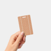 テクスチャードパターンのオレンジ色のラグが平らに横たわっている バッジ (手持ち)