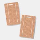 テクスチャードパターンのオレンジ色のラグが平らに横たわっている バッジ (正面&裏面)