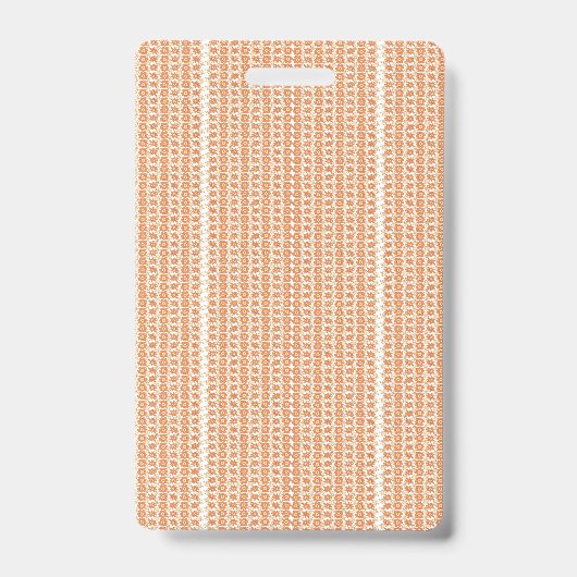 テクスチャードパターンのオレンジ色のラグが平らに横たわっている バッジ (正面)