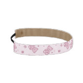 テディー・ベアの背景のピンク アスレチックヘッドバンド (左)
