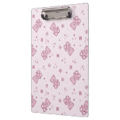 テディー・ベアの背景のピンク クリップボード (左)