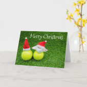 テニスボールにサンタ帽を被せたテニスのクリスマス カード (黄色い花)