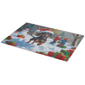 デシュント走の雪とクリスマスハット カッティングボード (角)