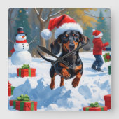 デシュント走の雪とクリスマスハット スクエア壁時計 (正面)