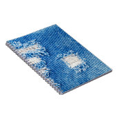 デニムジーンズに穴。破れた破れた青いjeを破った ノートブック (右側)