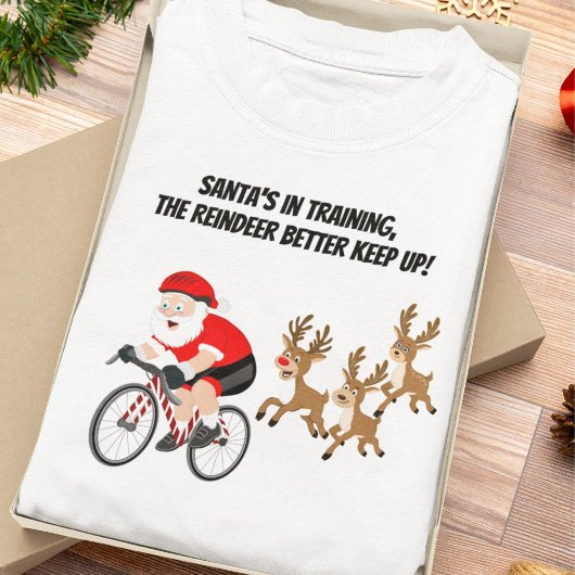 トナカイとサイクリングするサンタクロース Tシャツ