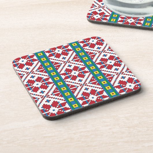 トライバルレッド、ブルー、およびホワイトスターの幾何学的パターン コースター (左側)