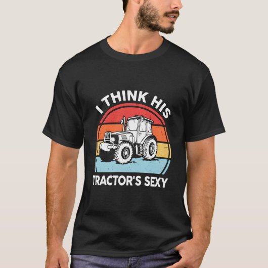 トラクター- 彼のトラクターは農家だと思います Tシャツ (正面)
