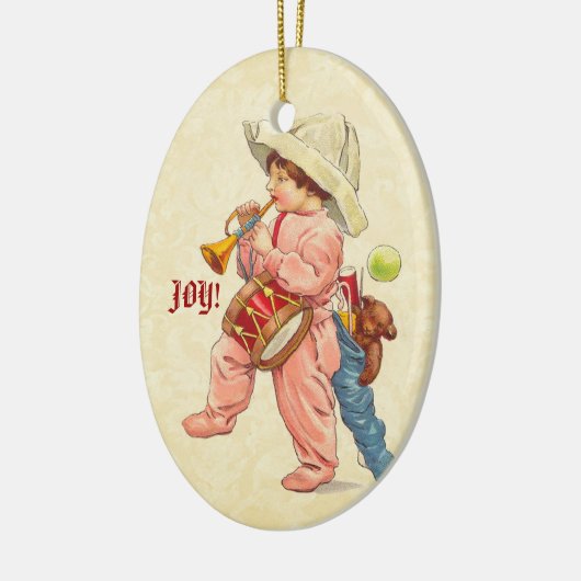 トランペットのドラムによって行進しているヴィンテージのクリスマスの男の子 セラミックオーナメント (左)