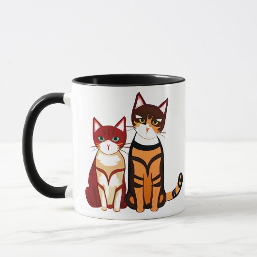 トラ縞の猫とオレンジ色の子猫 マグカップ (左)
