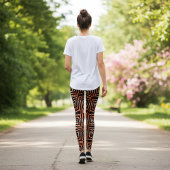 トレンディーオレンジと黒のOp Art幾何学的パターン レギンス