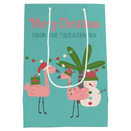 トロピカルクリスマスピンクフラミンゴスオンティール（緑がかった色） ミディアムペーパーバッグ (裏面)