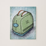 トースタージグソーパズル ジグソーパズル<br><div class="desc">穴から白パンを2切り出して緑と青のトースター。この小さなキッチン器具は、青と緑の背景に動揺して座ってストライプのいる。</div>