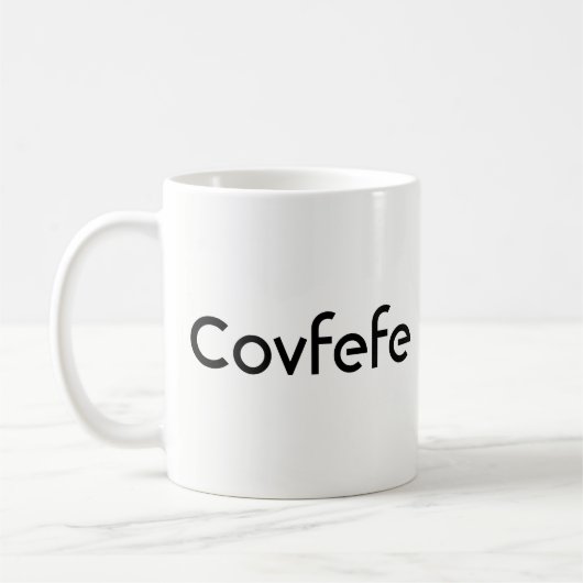 ドおもしろいナルドトランプ「Covfefe」 コーヒーマグカップ (左)