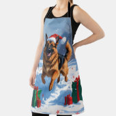 ドイツの走シェパードの雪とクリスマス帽子 エプロン (インサイチュ)