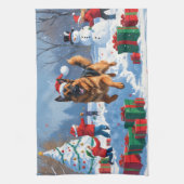 ドイツの走シェパードの雪とクリスマス帽子 キッチンタオル (縦)