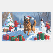 ドイツの走シェパードの雪とクリスマス帽子 長方形シール (正面)