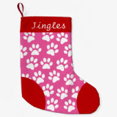 ドッグポーをテーマにしたピンクのクリパーソナライズされたスマス スモールクリスマスストッキング (正面)
