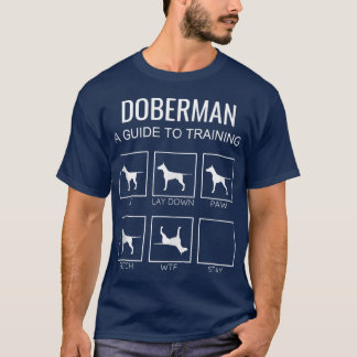 ドーベルマンを自慢げに思うオーナー向けの犬のおしっこトレーニングガイド図解 冗談Tシャツ Tシャツ