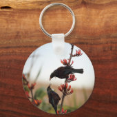 ニュージーランド産の亜麻の上にチュイの鳥 キーホルダー (正面)