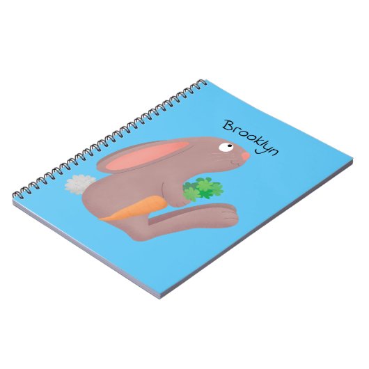 ニンジン漫画で座っているかわいいウサギ ノートブック (左側)